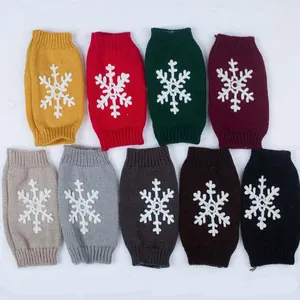 Various colors of knitted Christmas wrist warmers with white snowflake embroidery