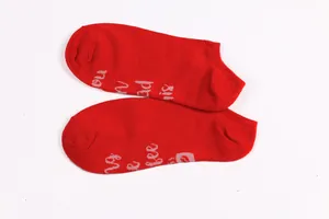 Red cotton ankle socks featuring humorous 'Bring me a beer' text printed on the soles.