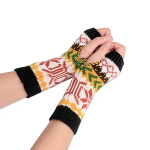 Close-up of winter knit fingerless gloves with a vibrant colorful snowflake jacquard pattern