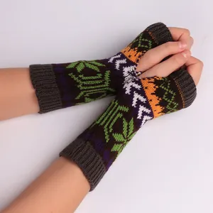 Knitted winter fingerless gloves featuring colorful snowflake pattern arm warmers