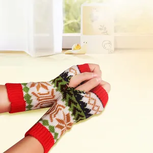 Close-up detail of colorful snowflake knit fingerless gloves for cozy winter warmth.