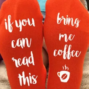 Bright orange novelty cotton socks with 'If you can read this, bring me coffee' text