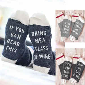 Funny cotton crew socks featuring 'If you can read this, bring me wine' slogan on soles