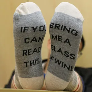 Novelty cotton crew socks featuring funny wine slogan printed on the soles for men and women