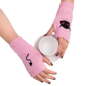 Pink knitted fingerless gloves with devil embroidery for Halloween holiday warmers