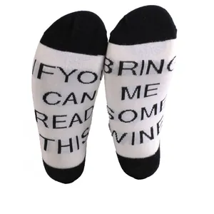 Funny novelty cotton ankle socks with 'Bring me wine' quote on soles for men and women