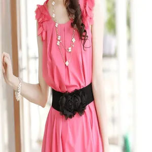 Detailed view of a black elastic waist belt featuring three elegant decorative fabric flowers