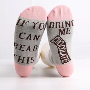 Detailed view of mid-calf cotton socks with funny Bring Me Chocolate sole text print