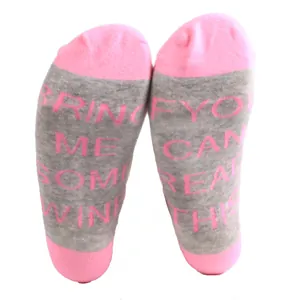 Detail view of funny pink and grey ankle socks with wine letter print on soles.