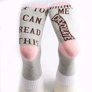 Detailed view of novelty cotton socks with funny slogan saying Bring Me Chocolate