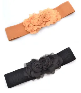 Pair of elegant wide elastic waist belts featuring large fabric rose flowers in tan and black
