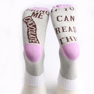 Detail view of the fun 'Bring Me Chocolate' woven lettering on cotton sock soles