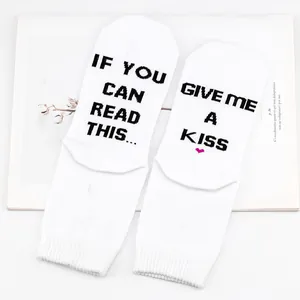 Detail of white cotton socks with funny 'If you can read this' English text print