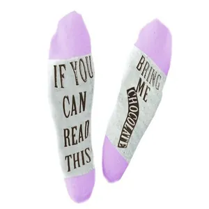 Detail view of funny purple socks with 'IF YOU CAN READ THIS BRING ME CHOCOLATE' print