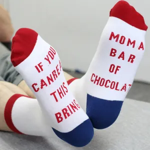 Detailed view of white cotton socks featuring funny red text and blue heel accents