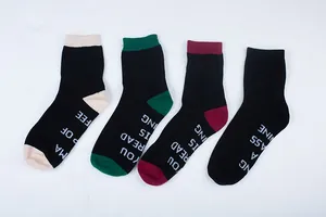 Detailed view of mid-calf cotton socks with funny English letter prints on the soles