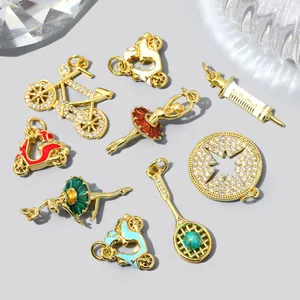 Detailed view of assorted copper zircon charms featuring ballet dancers and sports themes