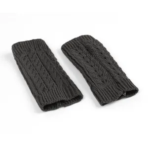 Detailed macro view of dark grey cable knit fingerless gloves with unique hollow design
