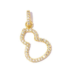 Detailed close-up of a luxurious gold-plated gourd pendant with cubic zirconia inlay