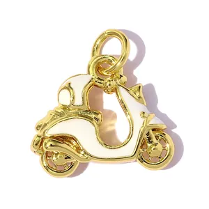 Detailed macro view of a gold-plated white enamel scooter charm pendant for jewelry DIY