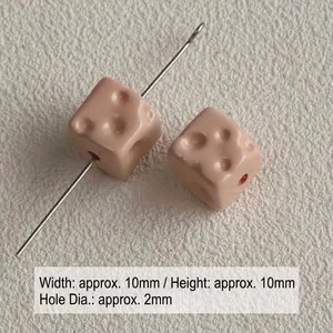 Macro view of 10mm cheese-shaped acrylic cube beads for DIY jewelry with 2mm hole