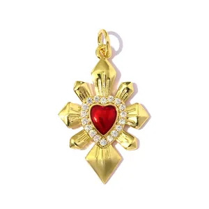 Macro detail of 18k gold plated starburst pendant with a red heart center and zircons