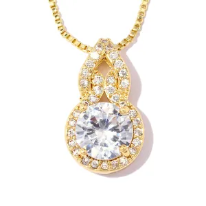 Macro detail of 18k gold-plated gourd pendant necklace with brilliant round zirconia stones