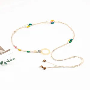 Handmade bohemian style woven waist chain with vibrant multi-colored beads and buckle