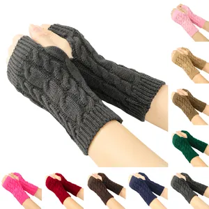 Multi-color overview of knitted cable pattern fingerless gloves on white background