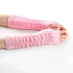 Detail view of pink cable-knit long fingerless gloves for women showing soft texture
