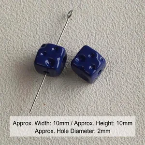 Macro view of 10mm dark blue acrylic cube beads with 2mm straight aperture for jewelry