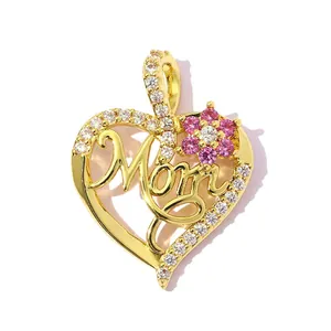 Detail of heart-shaped gold-plated pendant with Mom text and pink zircon flower