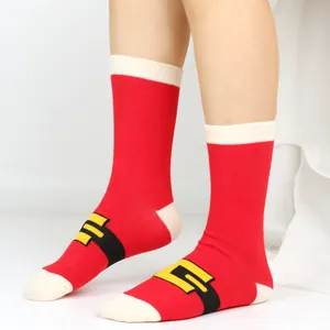 Detail view of festive red cotton Christmas socks featuring a Santa Claus belt pattern