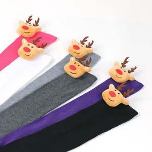 Detailed view of colorful Christmas over-the-knee socks featuring 3D plush reindeer decor.
