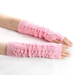 Close-up detail of soft pink cable-knit fingerless long arm warmers for autumn and winter