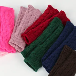 Macro detail of colorful winter cable knit arm warmers with soft knitted texture