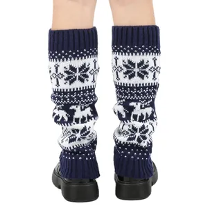 Detailed view of Christmas knitted leg warmers with snowflake and reindeer patterns
