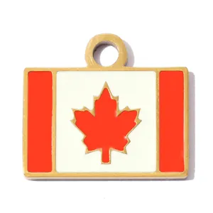 Macro detail of gold-plated stainless steel pendant featuring the Canadian flag design