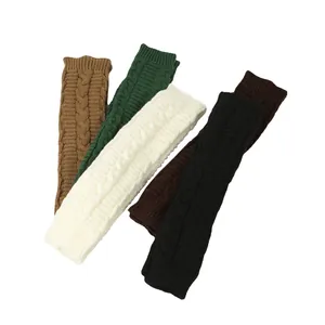 Detail of cable knit long arm warmers in multiple autumn colors showing the soft texture