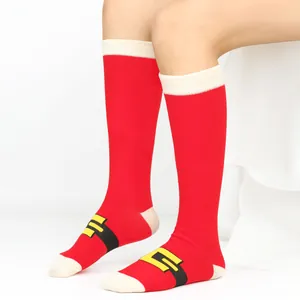 Detail view of red Christmas knee-high socks with Santa belt design for women and kids
