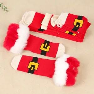 Detailed view of warm Christmas socks with fuzzy cuffs and festive belt design