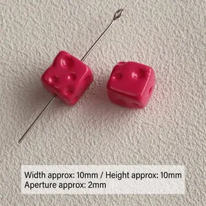 Detailed view of 10mm pink acrylic cheese cube beads with 2mm straight hole for DIY jewelry