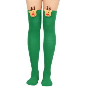 Detailed view of green Christmas over-the-knee socks with cute 3D plush reindeer heads.