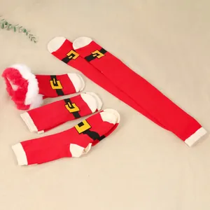 Detailed view of red Christmas socks in various lengths with Santa belt design