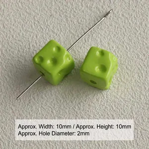Macro detail showing 10mm green acrylic cheese cube beads for DIY jewelry making