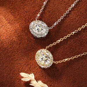 Macro detail of 2-carat moissanite oval halo pendant necklaces in silver and gold