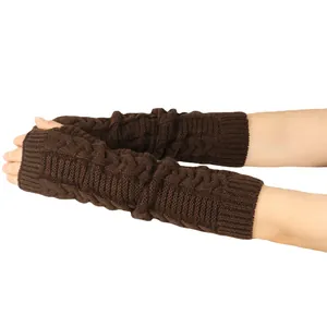 Detailed cable knit pattern on dark brown long fingerless winter arm warmers for women