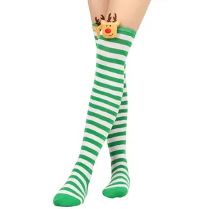 Detail view of green and white striped Christmas over-knee socks with plush reindeer