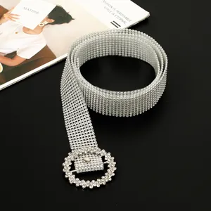 Elegant close-up view of a sparkling silver full rhinestone belt with round buckle detail