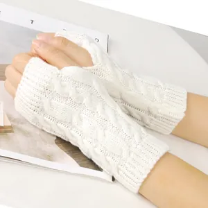 Close-up detail of white cable-knit fingerless gloves with thumb hole for autumn and winter warmth